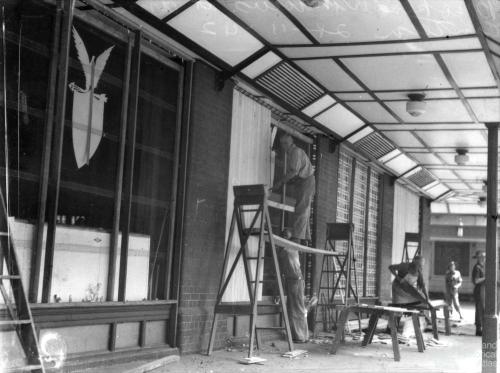 Repairing broken windows, American canteen, Brisbane 1942