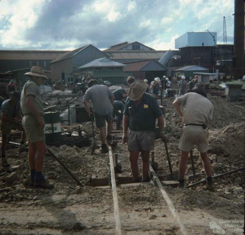 A gang working on sugar cane tram lines, Isis central sugar mill, 1976