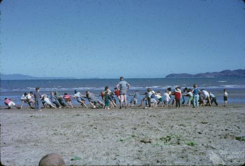 Sunday School picnic tug of war on the Strand, Townsville, 1962