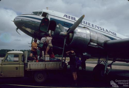 Loading cargo, Air Queensland DC3, Lockardt River airport, 1982