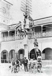 Telegraph pole at the front of the Mackay Post and Telegraph Office in River Street Mackay, c1920 