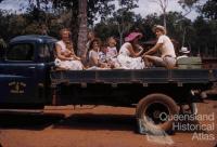 Travelling on Queensland Health & Home Affairs Dept truck, 1958