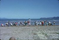 Sunday School picnic tug of war on the Strand, Townsville, 1962