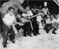 Cherbourg musician Angus Rabbitt (left) and others performing