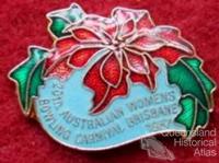 Brisbane badges which include poinsettia motif, 1930-60