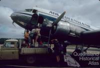 Loading cargo, Air Queensland DC3, Lockardt River airport, 1982