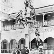 Telegraph pole at the front of the Mackay Post and Telegraph Office in River Street Mackay, c1920 