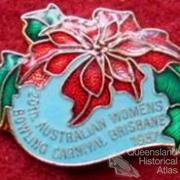 Brisbane badges which include poinsettia motif, 1930-60