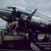 Loading cargo, Air Queensland DC3, Lockardt River airport, 1982