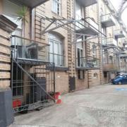 Apartment balconies facing car park of AML&F wool stores, 2014