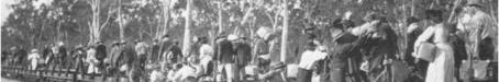 Railway passengers crossing Fitzroy River on flat wagons, c1900